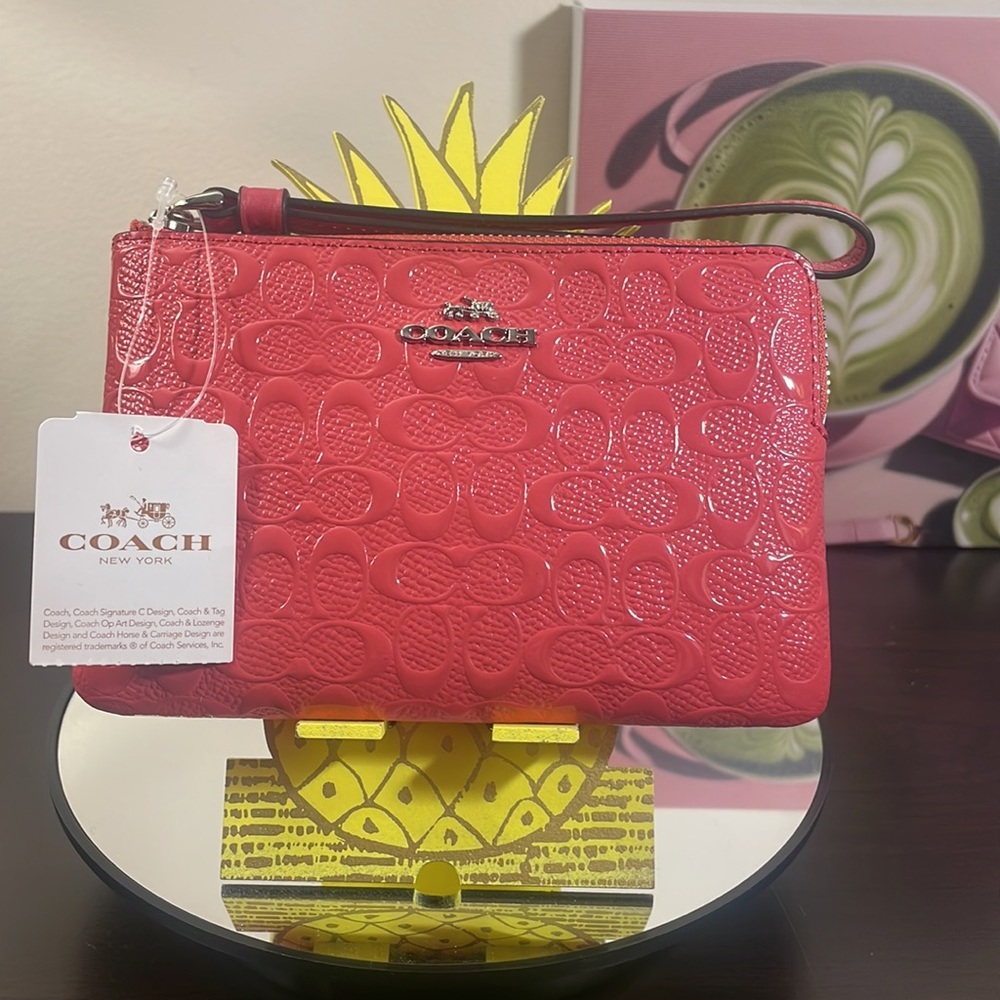 NWT Coach Wristlet raised C’s in strawberry color